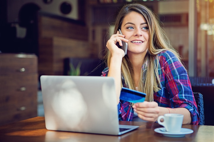 Girl Is Shopping Online And Calling Card Support For Help