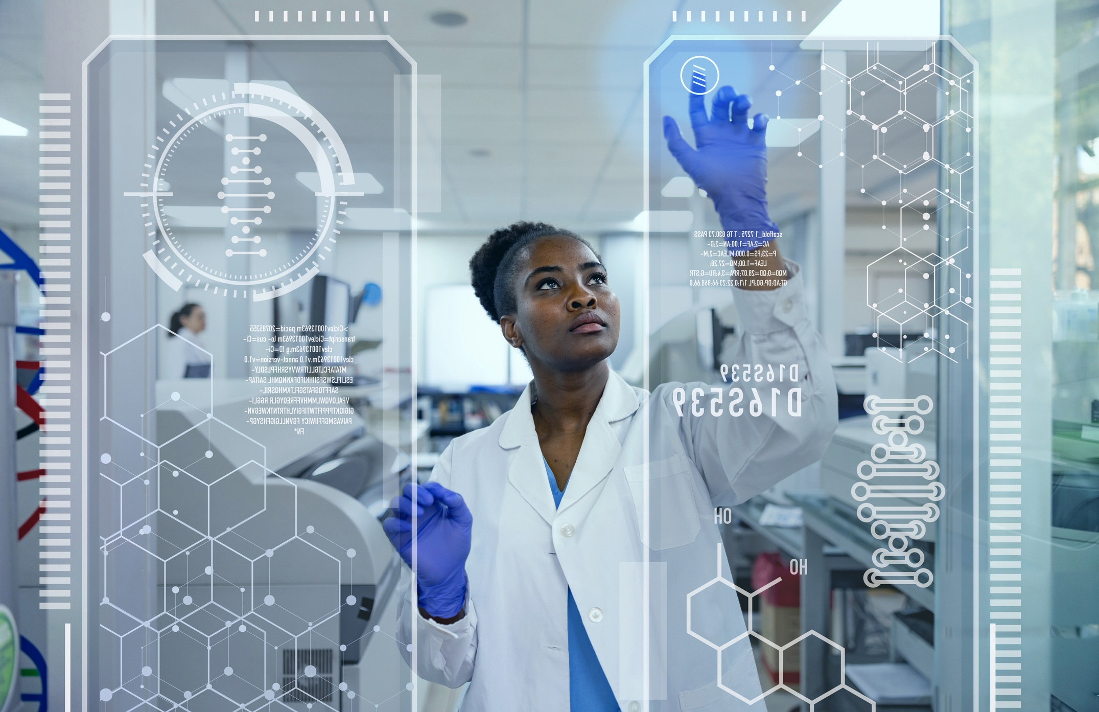 Biochemist working at a lab using technology to see a molecular structure